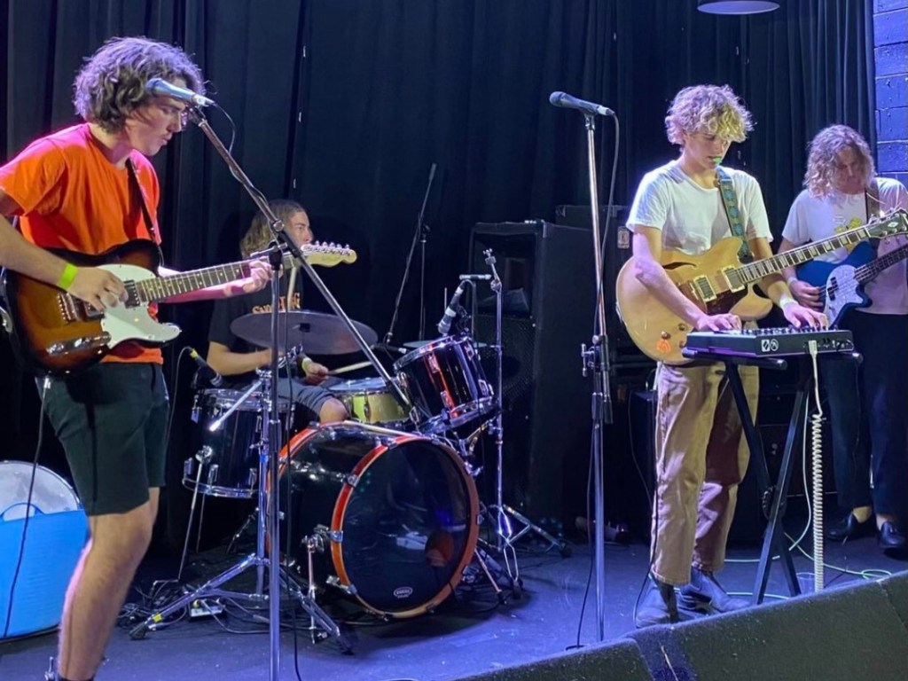 Local band Slinky Red playing on stage.